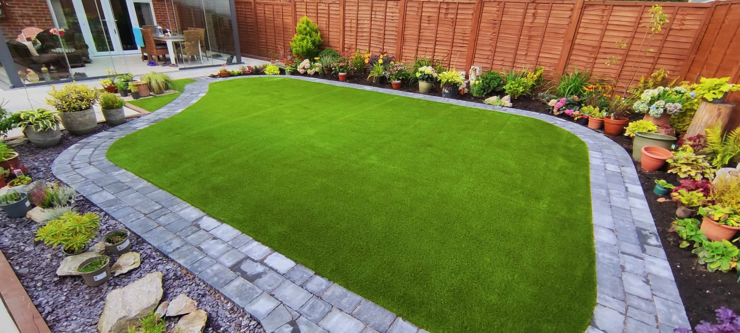 Artificial grass laid in a garden in Hellingly