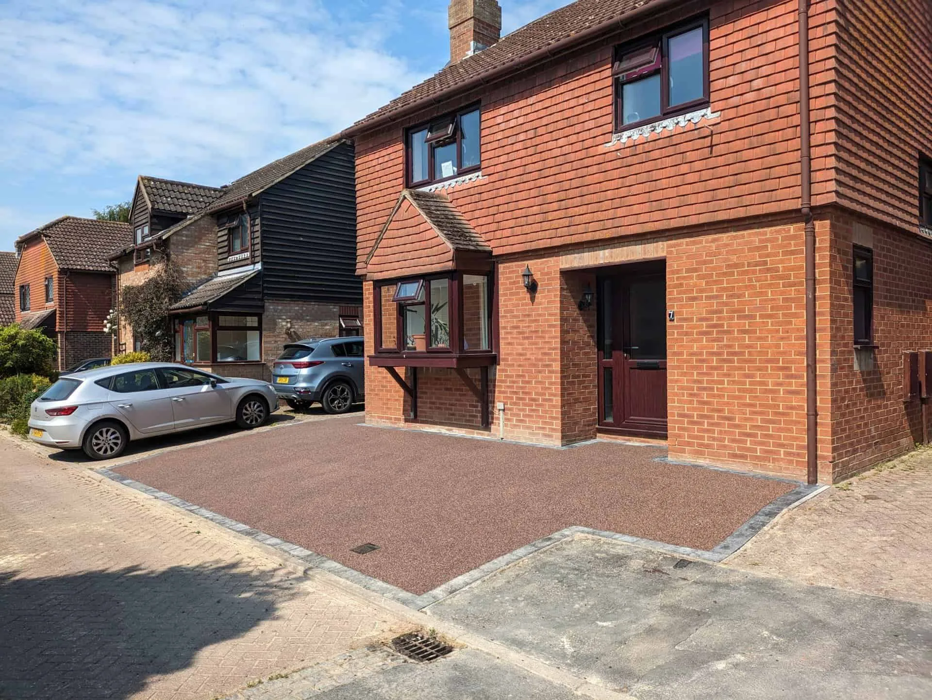 Finished resin bound driveway in Heather colour outside a house in Hailsham