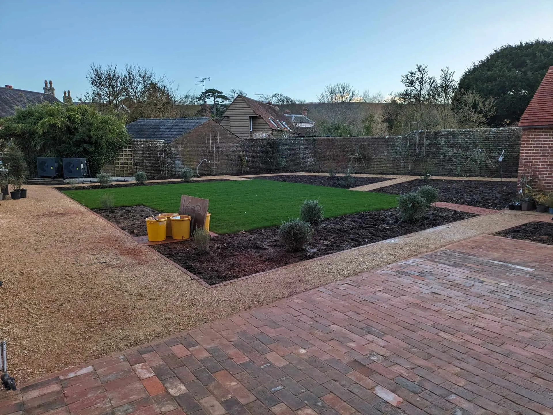 Self-binding gravel paths and new lawn in a landscaped garden in Firle