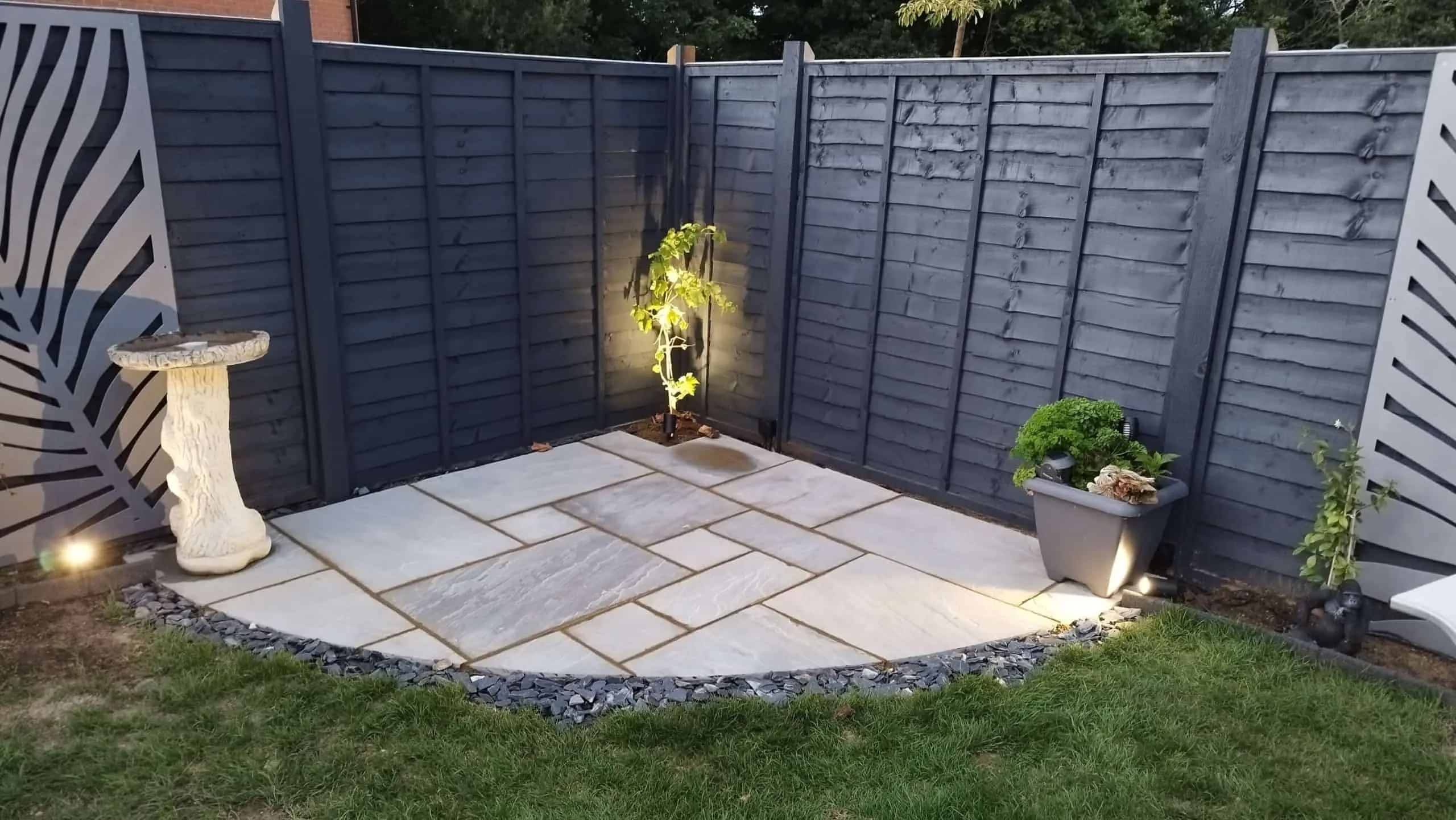 Indian sandstone patio with recessed lights at night in Hellingly