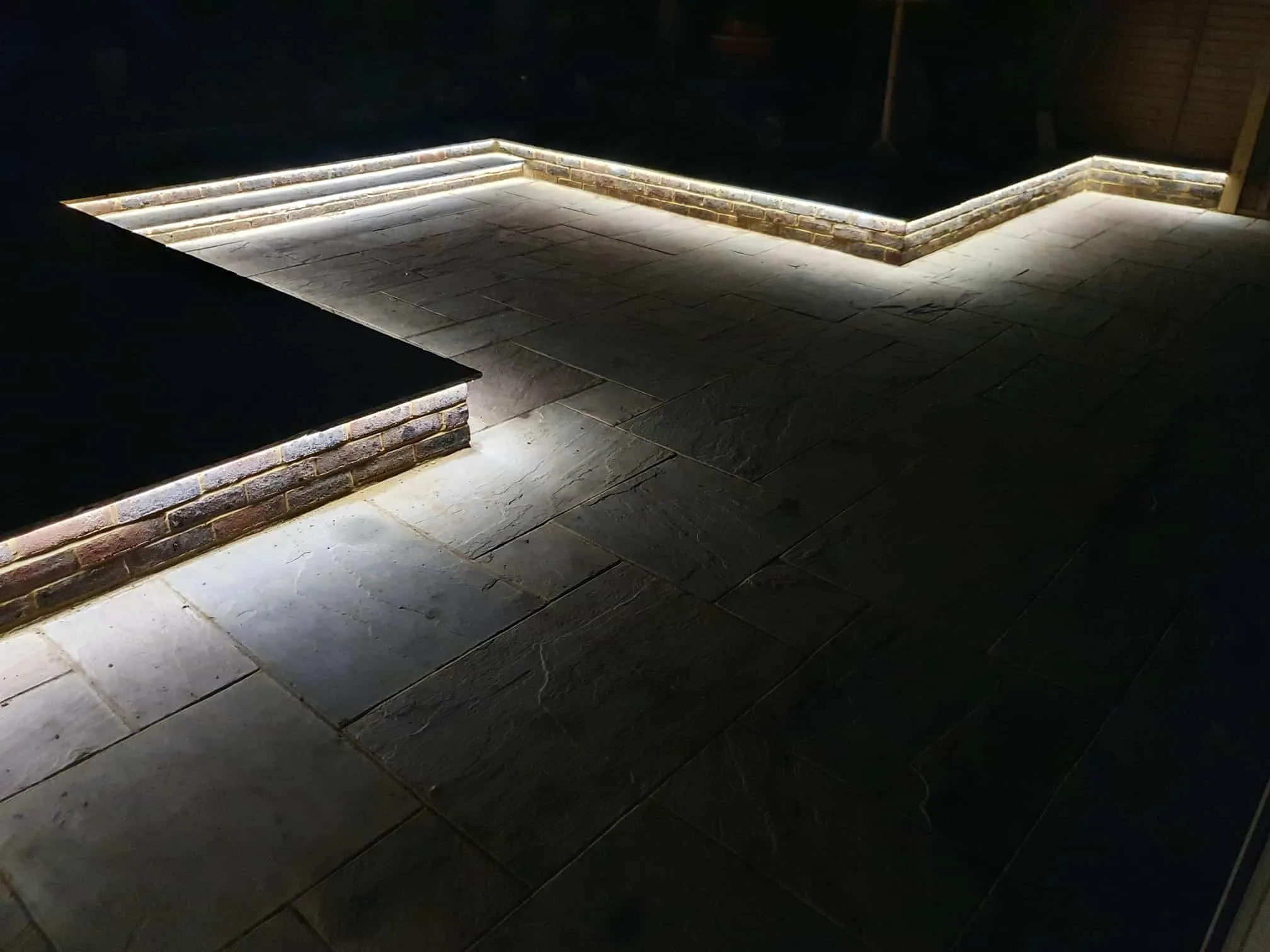 Patio with recessed lighting by RF Construction